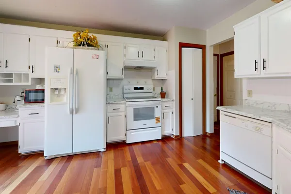 Behind furniture and appliances